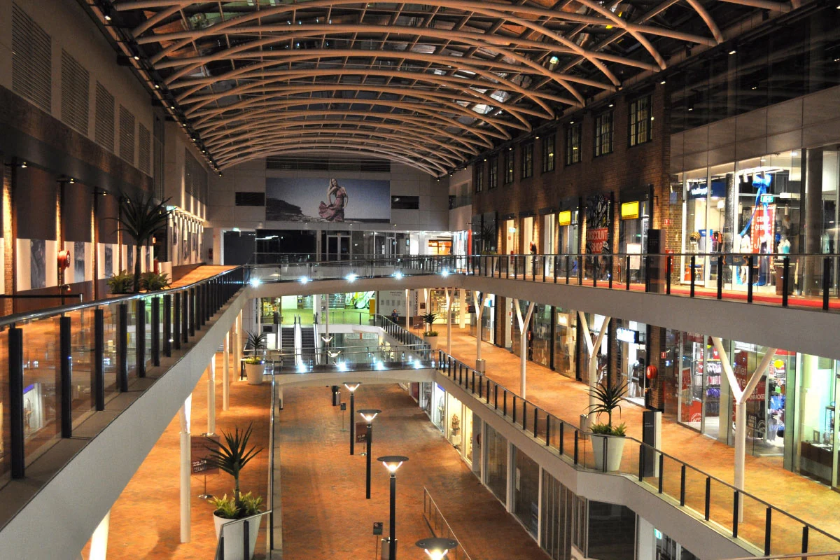 Inside Birkenhead Point: a vaulted timber roof over three levels of shops